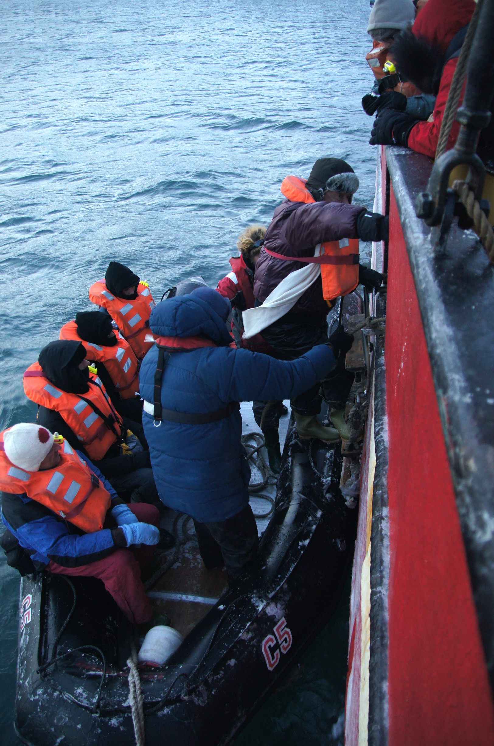 Climbing from dinghy to ship